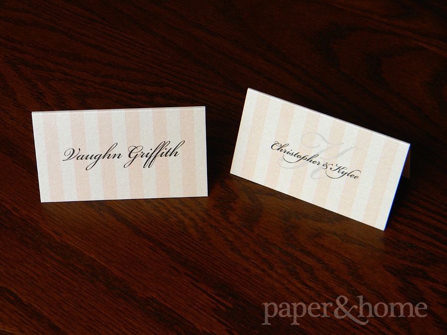 Blush pink striped place cards with monogram on the back