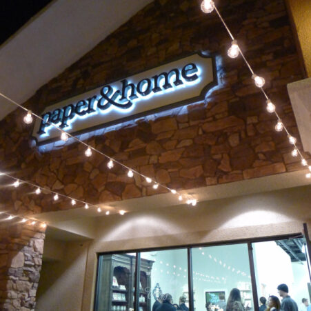 Paper and Home Storefront Sign with Bistro Lighting